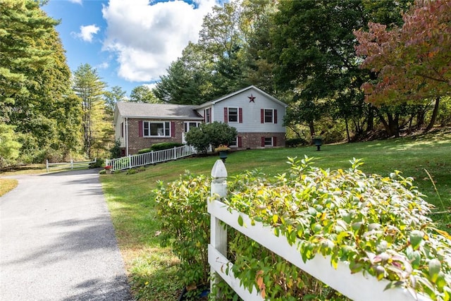 tri-level home featuring a front yard