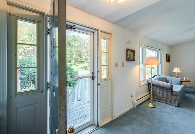 doorway to outside featuring plenty of natural light, carpet, and a baseboard heating unit