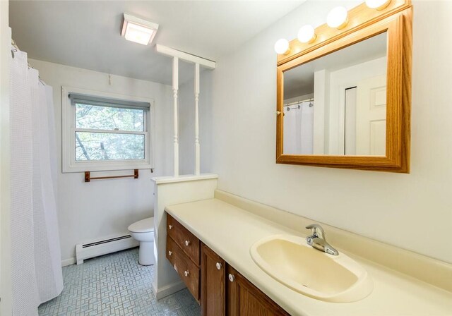 bathroom featuring vanity, a baseboard radiator, and toilet