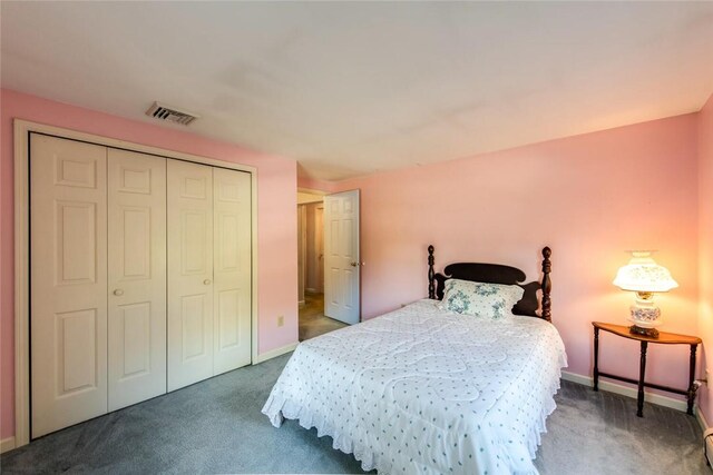 carpeted bedroom with a closet