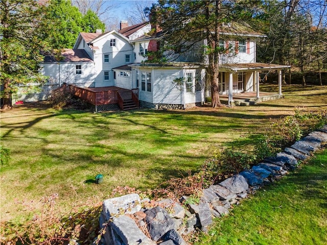 exterior space with a deck and a yard