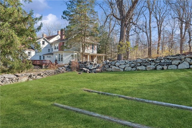 view of yard featuring a wooden deck