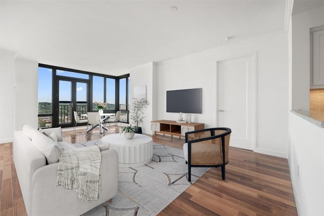 living room featuring floor to ceiling windows, crown molding, french doors, and wood-type flooring