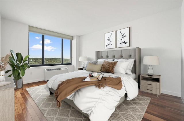 bedroom featuring dark hardwood / wood-style floors and radiator