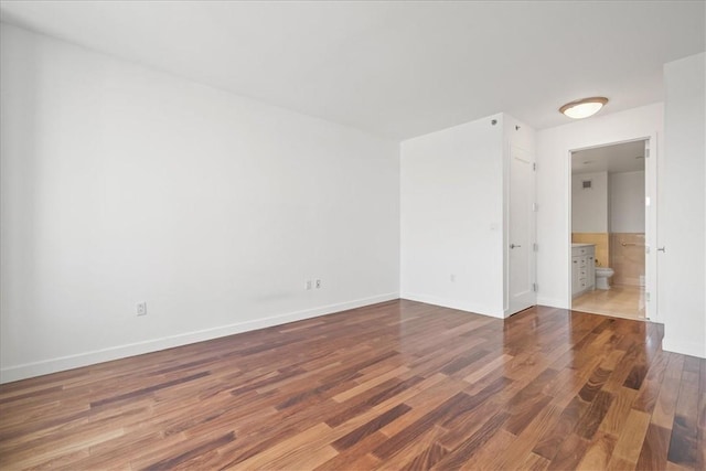 empty room featuring hardwood / wood-style flooring