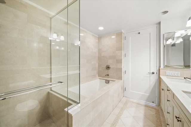 bathroom with tile patterned flooring, vanity, and plus walk in shower