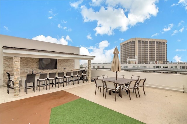 view of patio featuring an outdoor bar