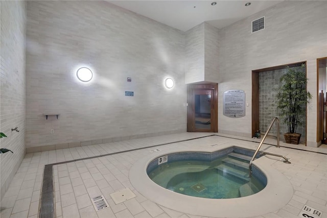 view of pool featuring an indoor in ground hot tub