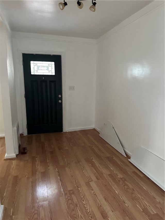 foyer featuring wood walls