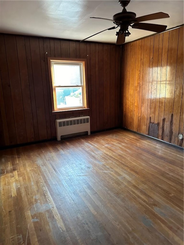 unfurnished room featuring wood ceiling, wooden walls, and vaulted ceiling