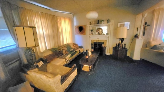 carpeted living room featuring vaulted ceiling