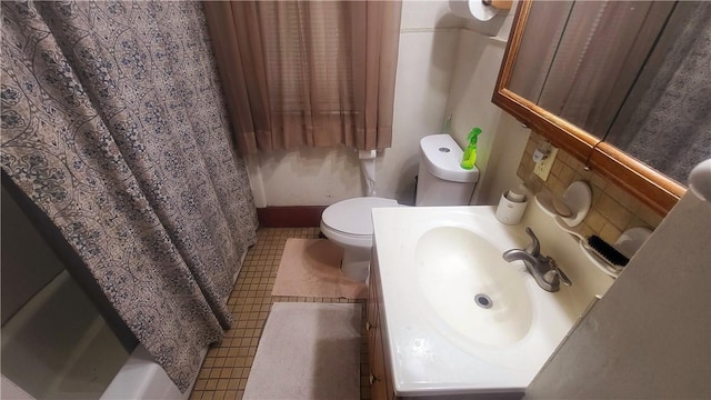 full bathroom with vanity, toilet, and shower / tub combo with curtain