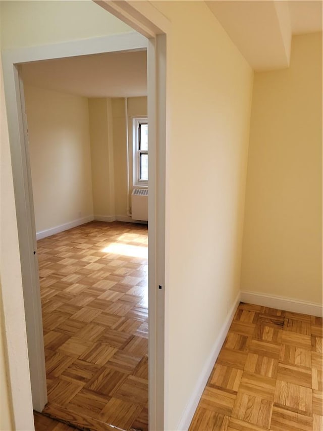 hall featuring radiator and light parquet floors