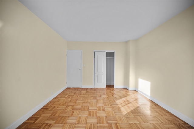 empty room with light parquet floors