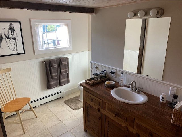 bathroom featuring wood ceiling, vanity, a baseboard heating unit, beam ceiling, and toilet