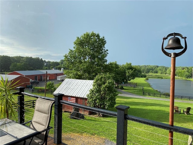 exterior space with a yard and a water view