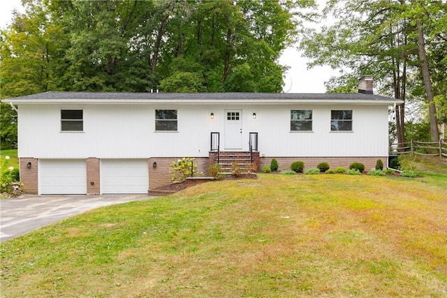 view of front of house with a garage and a front lawn