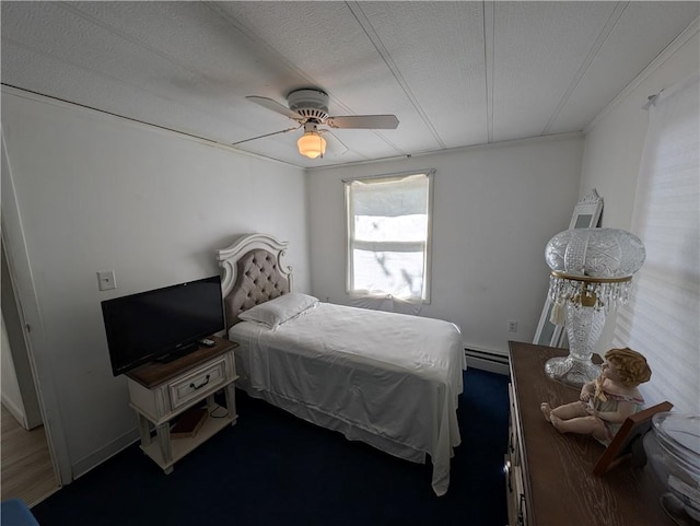 bedroom featuring ceiling fan, crown molding, a baseboard radiator, and a textured ceiling