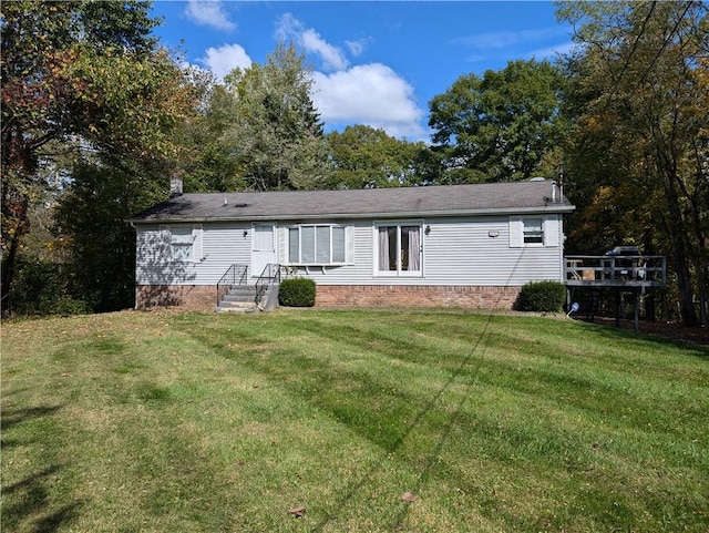 back of house with a lawn