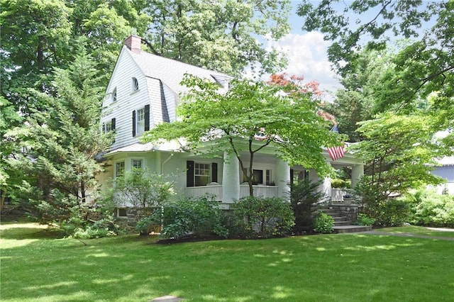 exterior space featuring a porch and a front lawn