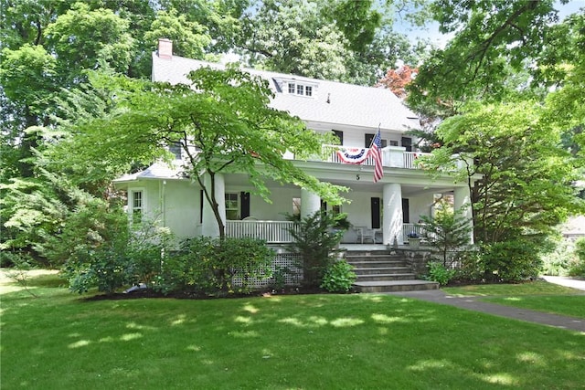 view of front of home featuring a porch and a front lawn