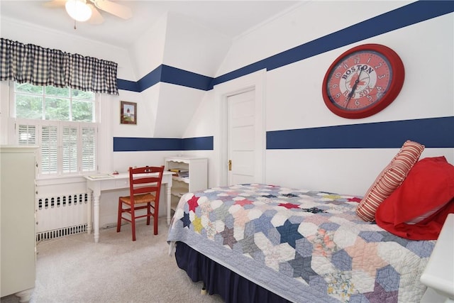 carpeted bedroom featuring radiator, ceiling fan, vaulted ceiling, and ornamental molding