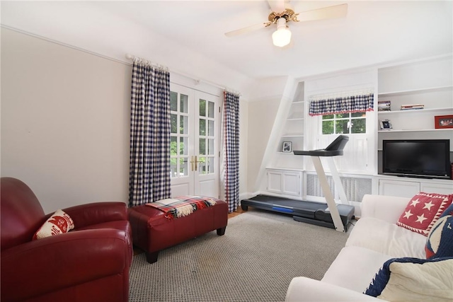 living room featuring carpet, french doors, a wealth of natural light, and ceiling fan