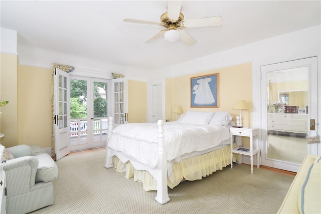 carpeted bedroom featuring access to exterior, ceiling fan, and french doors