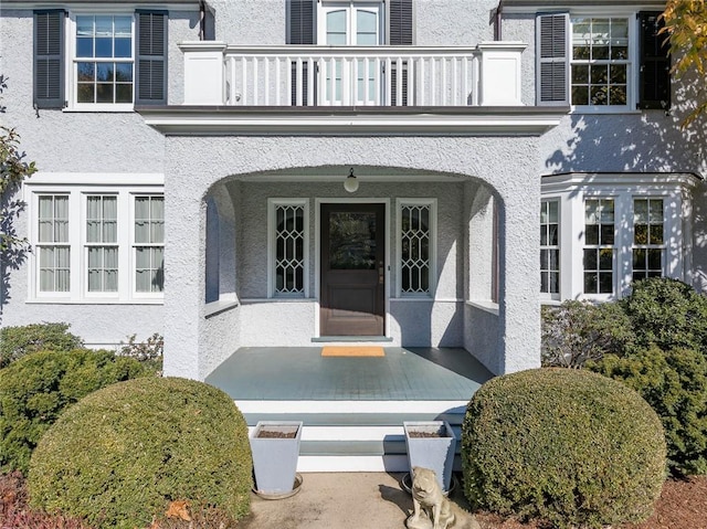 property entrance with a balcony