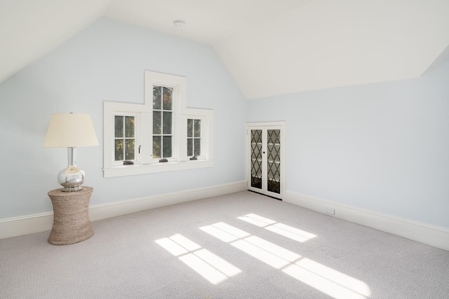 bonus room featuring carpet floors and lofted ceiling