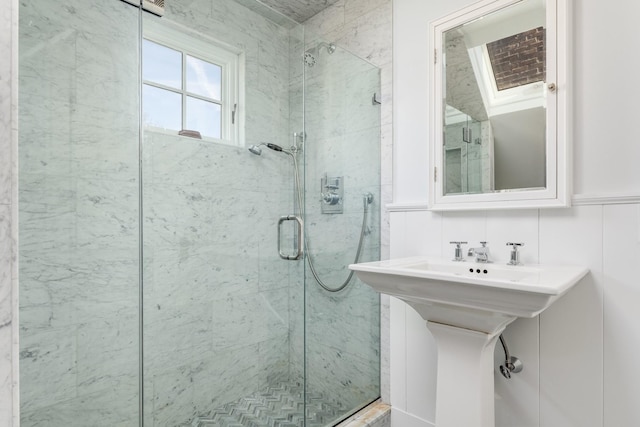 bathroom with tile walls and walk in shower