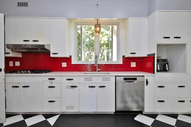 kitchen with backsplash, sink, white cabinetry, and stainless steel appliances