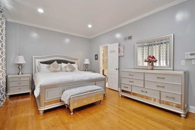 bedroom with hardwood / wood-style flooring and ornamental molding