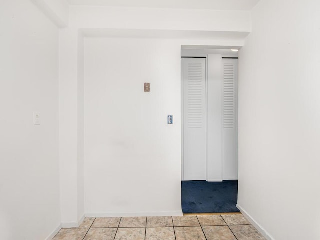 interior space featuring light tile patterned floors