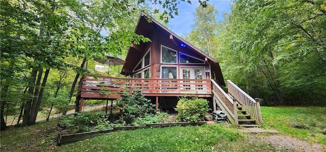 38 Winterthur Rd, Woodridge, NY 12789 - rear view of house with a vegetable garden, a deck, and stairs