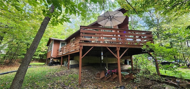 rear view of house with a wooden deck