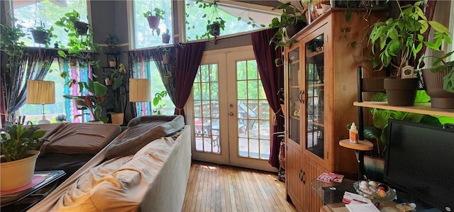 entryway with french doors and light hardwood / wood-style floors