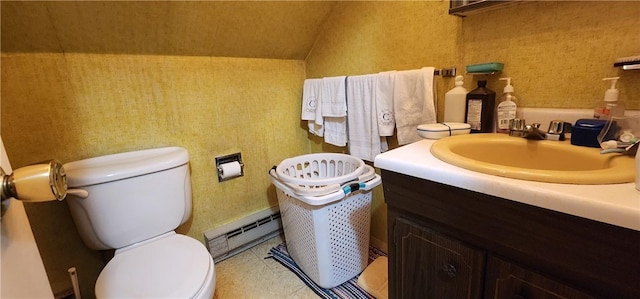 bathroom featuring vanity, toilet, lofted ceiling, and a baseboard radiator