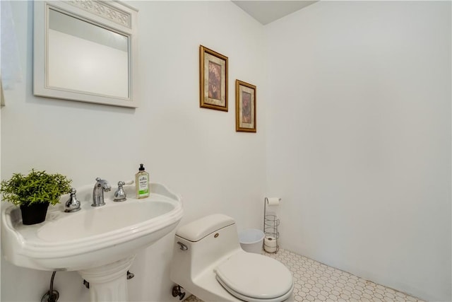 bathroom with toilet and sink