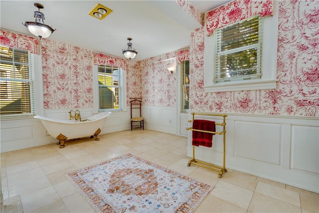 bathroom featuring a bathing tub and tile patterned flooring