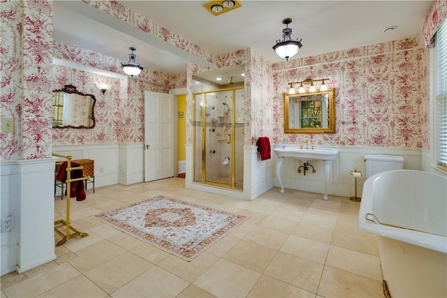 bathroom with tile patterned floors and an enclosed shower