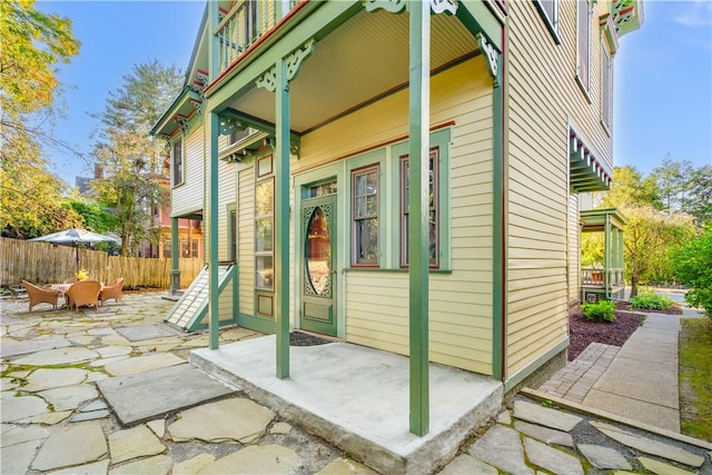 view of side of property featuring a patio