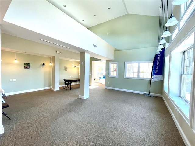 unfurnished room with carpet flooring and vaulted ceiling