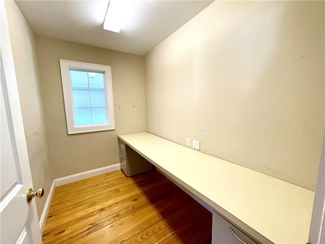 unfurnished office featuring light hardwood / wood-style floors