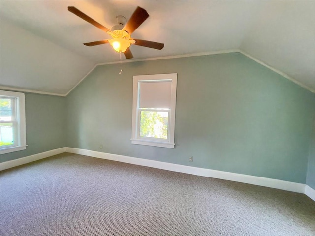 additional living space featuring ceiling fan, carpet floors, and vaulted ceiling