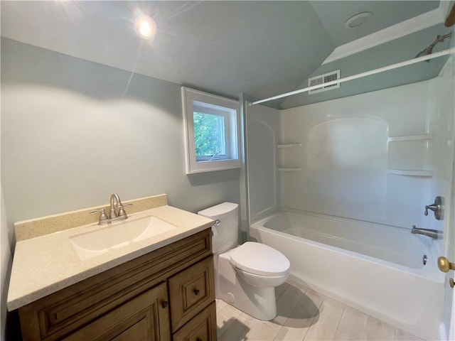 full bathroom featuring tile patterned floors, shower / bath combination, lofted ceiling, toilet, and vanity