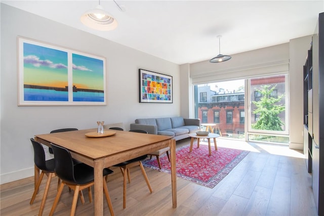 dining space featuring light hardwood / wood-style flooring