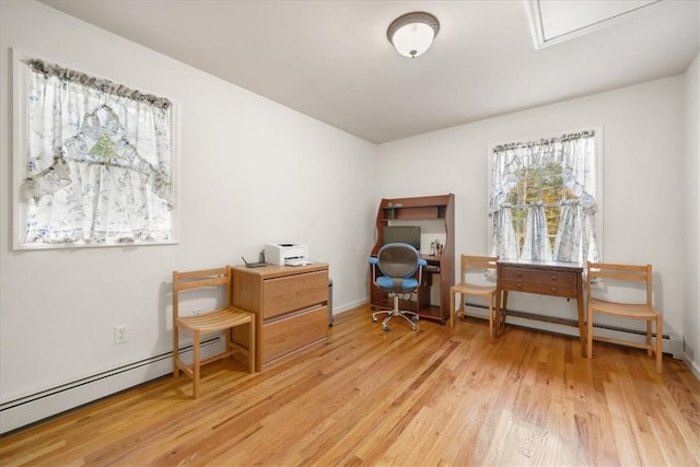 interior space featuring light hardwood / wood-style flooring and a baseboard heating unit