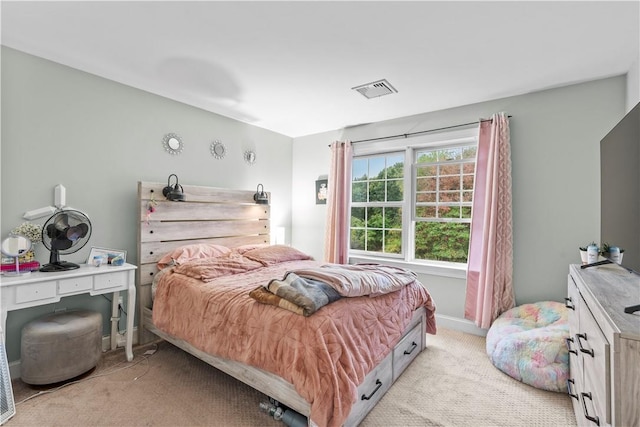 bedroom with light colored carpet