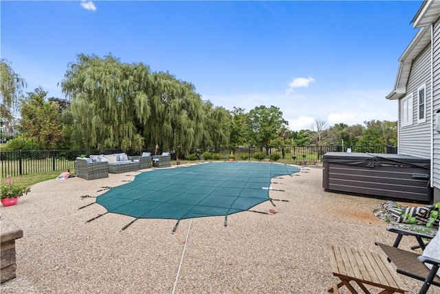 view of pool with a patio, a hot tub, and an outdoor hangout area